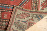 Hand-knotted reverse weave and fringe detail of this antique Caucasian rug.
