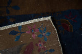 Hand-knotted back of antique Fette Li rug, with blue, pink floral motifs and white fringe.