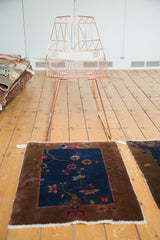 Angled view of antique Chinese Fette Li rug mat, art deco floral design.