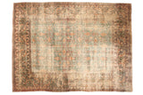 Distressed antique Khorassan carpet, faded denim blue and antique ivory floral palmettes.