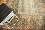 Textured detail of distressed antique Khorassan carpet: faded blue field and European-influenced borders.