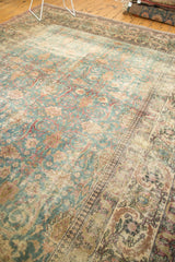 Distressed Khorassan rug: faded denim blue, antique ivory, European floral palmettes.