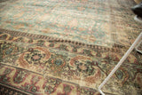 Distressed antique Khorassan carpet, faded denim blue field, Mina Khani and Herati borders.
