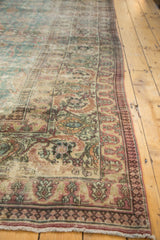 Aged texture of antique distressed Khorassan carpet borders, showing faded colors and European influence.