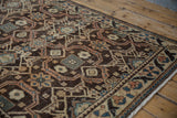 Hand-knotted Hamadan runner with geometric lattice, brown, beige, and blue pile texture.