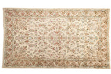 Traditional hand-knotted vintage Kerman rug with intricate floral motifs in muted pastels on an ivory field, 4' x 7'.