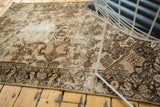 Close-up of vintage Hamadan rug with distressed texture, showing foundation, floral motifs, and blues.