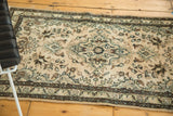 Vintage Hamadan rug's lower dark chocolate brown border with antique ivory floral motifs.