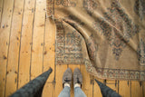 Folded antique Persian Doroksh rug, intricate floral paisley and mini boteh border.