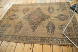 Antique Doroksh rug's intricate main border of mini botehs with germinating budding flowers.