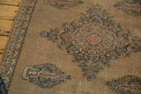 Antique Doroksh rug detail showing intricate Mil Fleur field and mini boteh border with wear.