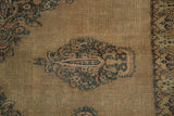 Antique Doroksh rug with sand field, Mil Fleur motif, and ornate boteh border.