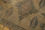 Antique Doroksh rug detail: Mil Fleur floral and paisley motifs, intricate border, worn camel field.