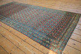 Vintage Serbend runner's staggered boteh motif and border in dusty raspberry and aqua blue, showing even wear.