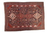 Antique Qashqai carpet, central medallion, allover field of flora, fauna in wine red, navy, gold, 5'11