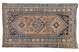 Vintage Kamseh rug, apricot field, triple navy blue diamond medallions, geometric motifs. 4'7