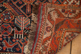Antique Qashqai rug construction with visible hand-knotted foundation, fringe, and tribal patterns.