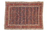Antique Afshar rug, indigo field, allover serrated leaf design, red borders, circa 1900.