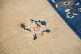Art Deco Chinese Peking carpet pile showing mauve blossom, blue vine, and border.