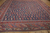 Antique Afshar rug's complex red, blue, and ivory border patterns with fringe detail.
