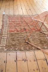 Distressed Northwest Persian rug with abrash, brick red and brown geometric lattice, and lower border.