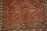 Worn bottom end of Northwest Persian rug, showing distressed texture, abrash, and lattice patterns.