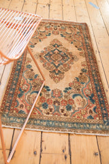 Distressed vintage Kazvin runner: beige field, blue and peach floral designs.