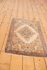 Distressed vintage Kazvin rug runner showing soft apricot and powder blue floral vinery.