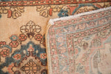 Vintage Kazvin runner's distressed floral pile, hand-knotted foundation, and fringe.