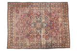 Antique Kerman carpet, navy medallion, cherry red mil fleur field, with mostly even pile. 9'9