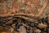 Antique Mahal carpet detail showing unusual chocolate bronze and navy blue oversized motifs.