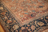 Antique Mahal carpet corner with navy blue border and chocolate bronze floral motifs.