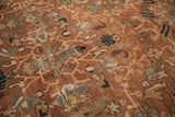 Worn pile of an antique Mahal rug showing chestnut, navy, and ivory floral motifs.