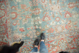 Distressed Persian Mahal carpet detail: worn pile, visible foundation, faded cranberry and blue florals.