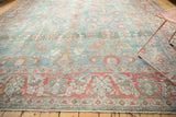 Distressed vintage Mahal carpet border with pale cranberry and sea foam floral motifs.