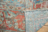 Distressed Mahal rug close-up, faded red and blue floral pile, visible foundation, woven reverse.