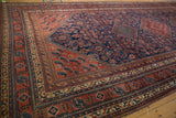 Detailed angle of a tribal Afshar runner's corner, showing intricate geometric borders in cherry red and indigo.