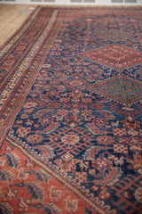 Low-angle perspective of a collector Afshar runner showing its intricate tribal motifs and texture.
