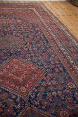 Angled view of a vintage Afshar runner, highlighting its low pile and intricate tribal medallions.
