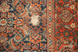 Close-up vintage Mahal carpet, indigo Herati motif, red turtle border, with exposed foundation.