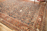 Corner of vintage Mahal carpet with indigo Herati field, madder red turtle border, foundation wear.