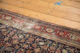 Distressed antique Malayer carpet edge, revealing threadbare herati motifs.