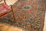 Antique Qashqai rug with light sky blue central medallion and madder red herati field.