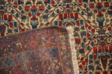 Vintage Kurdish Bijar rug corner, revealing fringe, secured side, and hand-knotted foundation.