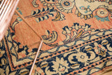 Vintage Lilihan rug section, densely ornamented floral bouquets in dusty rose and navy.