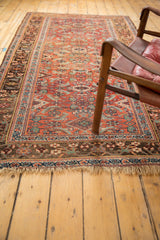 Antique Kurdish Bijar rug showing madder root red field, geometric herati pattern, and natural fringe.