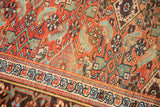 Antique Kurdish Bijar rug detail: herati motif field in madder red, sky blue, and geometric border.