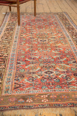 Antique Kurdish Bijar rug corner, highlighting madder root rust herati motifs and etched darker borders.