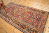Antique Kurdish Bijar rug's aged madder red field, herati motif, diamond medallions.