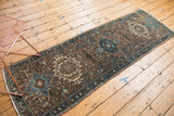 Distressed Karaja rug detail: geometric medallion with hook and latch motif, low pile.